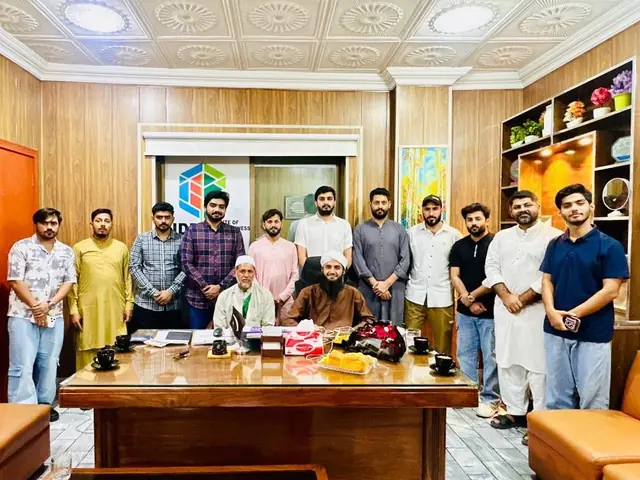 Group gathered around a desk at an institute office